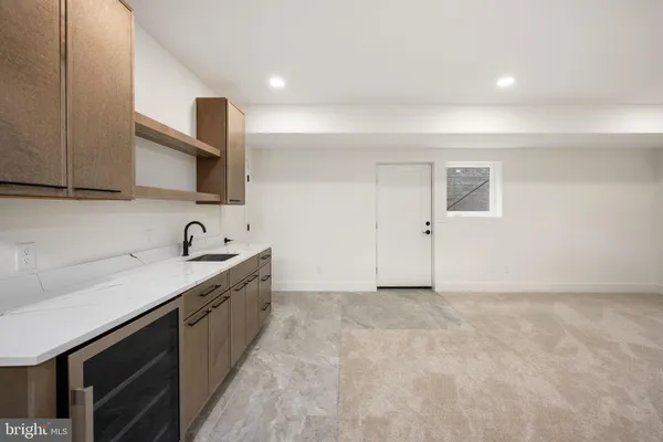 a kitchen with a sink and cabinets