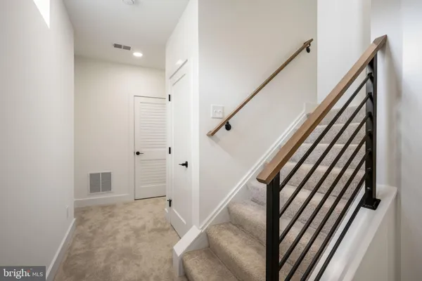a view of a hallway with staircase