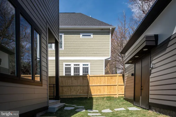 a view of house with backyard