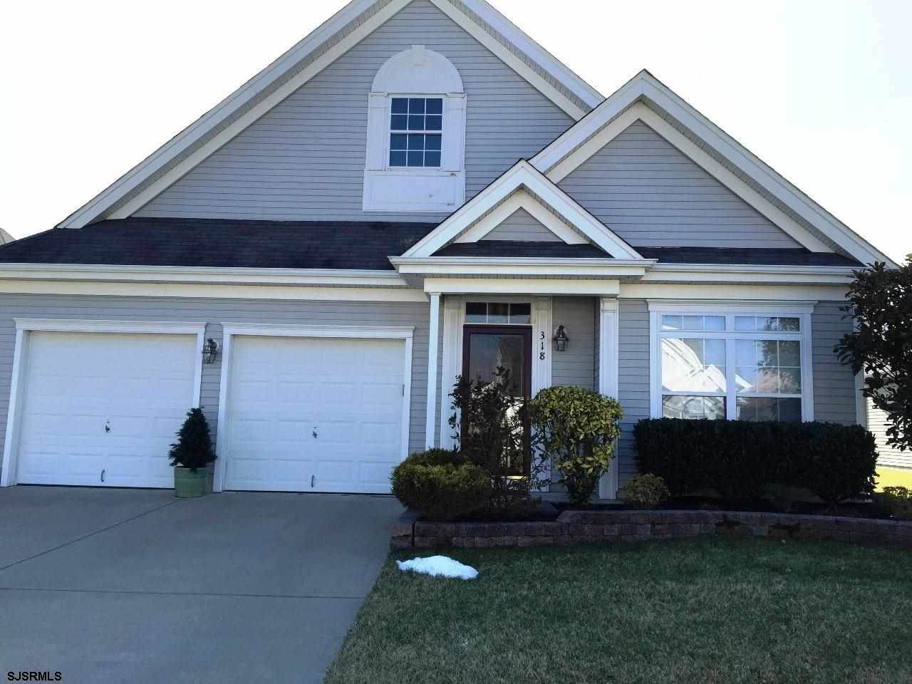 318 Mcclellan Road Egg Harbor Township, NJ 08234 - Photo 1 of 1 a front view of a house with garden