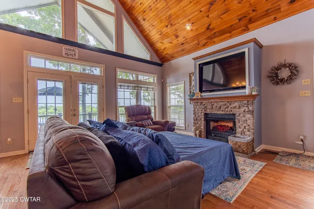 a view of a livingroom with furniture and a fireplace