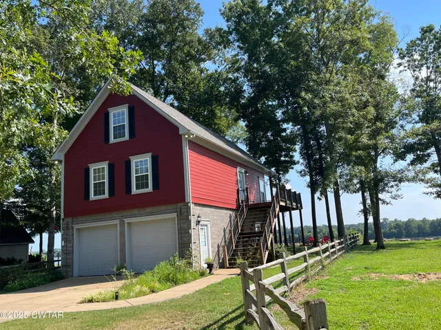 a house view with a backyard space