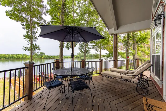 a view of a roof deck with furniture