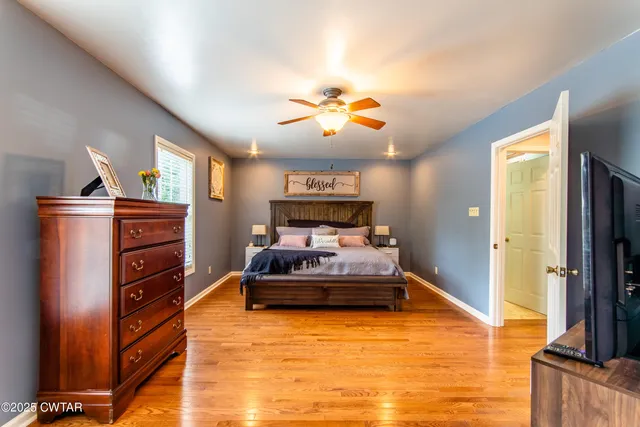 a bed room with a bed and a flat screen tv