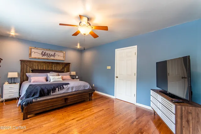 a bathroom with a sink mirror vanity and shower