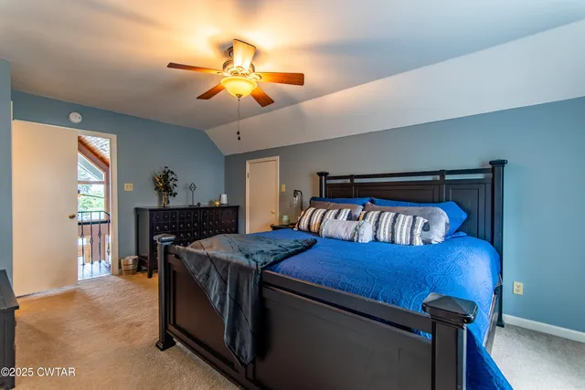 a white toilet sitting next to a bathroom sink and vanity