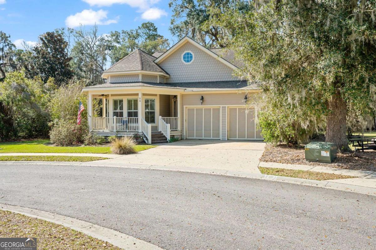 a view of a house with a swimming pool and sitting area