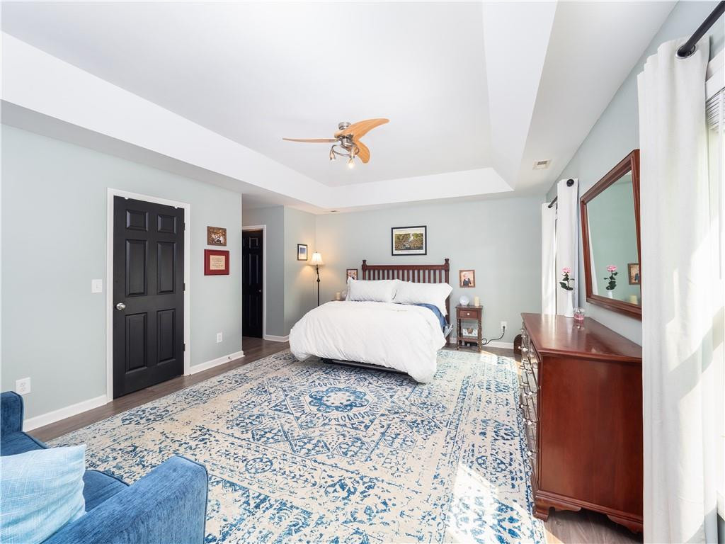 306 Green Pasture Road Mebane, NC 27302 - Photo 15 of 35 a bedroom with a bed and wooden floor