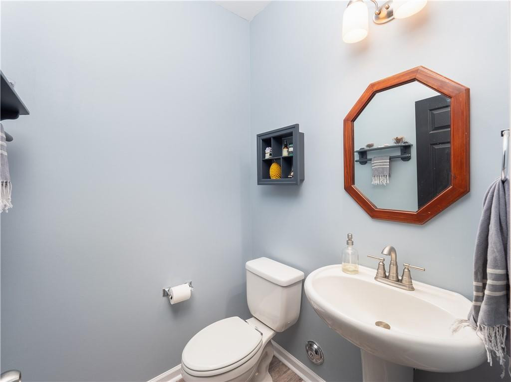 306 Green Pasture Road Mebane, NC 27302 - Photo 16 of 35 a bathroom with a toilet a sink and mirror