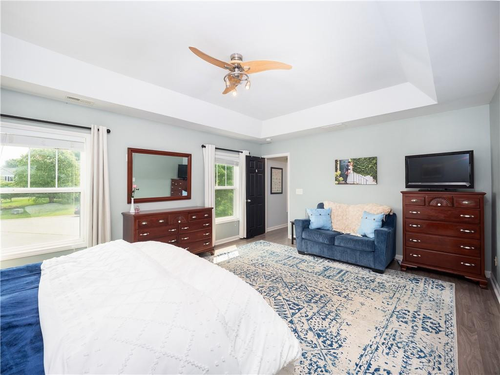 306 Green Pasture Road Mebane, NC 27302 - Photo 17 of 35 a bedroom with a bed and a flat screen tv