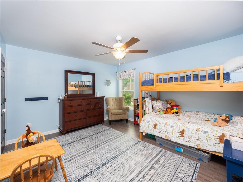 306 Green Pasture Road Mebane, NC 27302 - Photo 23 of 35 a bedroom with a bed and wooden floor
