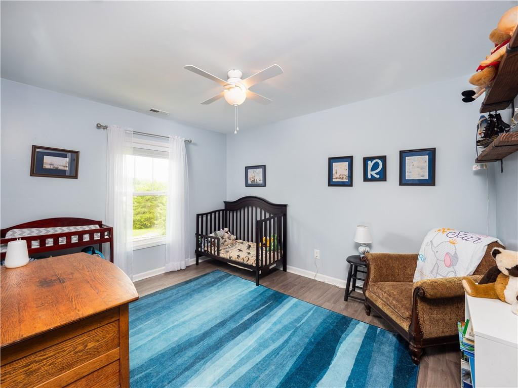 306 Green Pasture Road Mebane, NC 27302 - Photo 25 of 35 a living room with furniture and a wooden floor