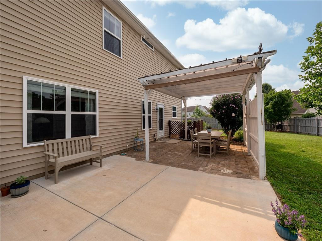 306 Green Pasture Road Mebane, NC 27302 - Photo 28 of 35 a view of a patio with a table and chairs