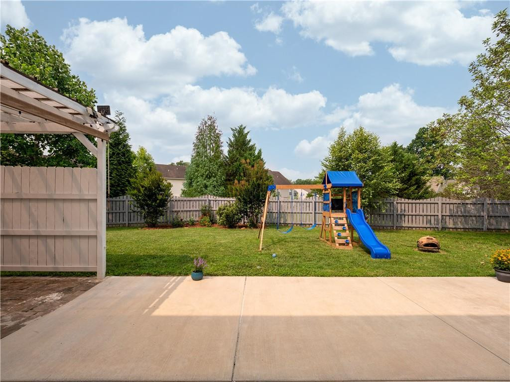 306 Green Pasture Road Mebane, NC 27302 - Photo 29 of 35 a view of a park with swings and slides