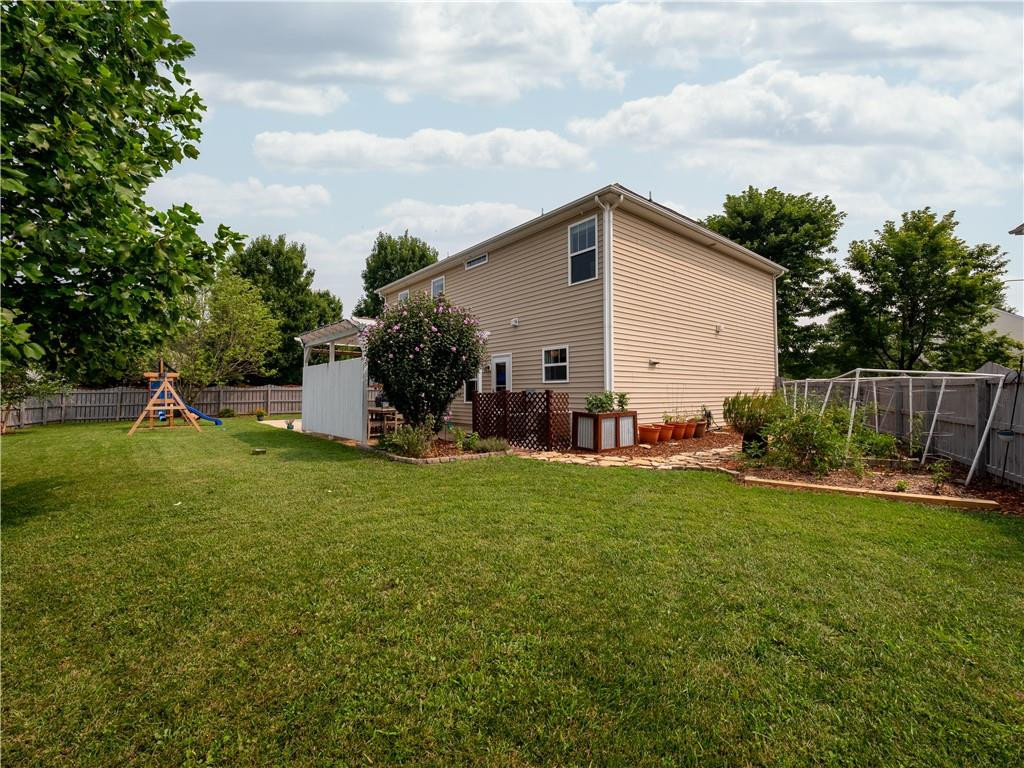 306 Green Pasture Road Mebane, NC 27302 - Photo 30 of 35 a view of a backyard with plants and a garden