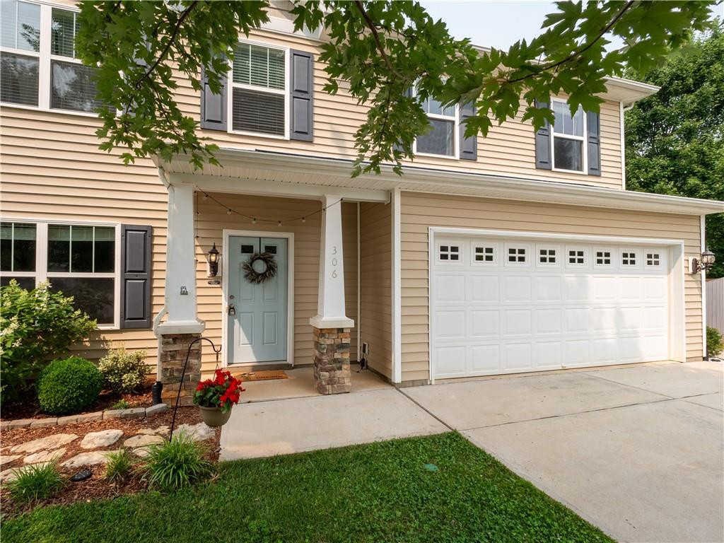 306 Green Pasture Road Mebane, NC 27302 - Photo 3 of 35 a front view of a house with a yard and garage