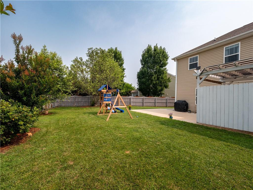 306 Green Pasture Road Mebane, NC 27302 - Photo 31 of 35 a swimming pool with lots of tress in front of it