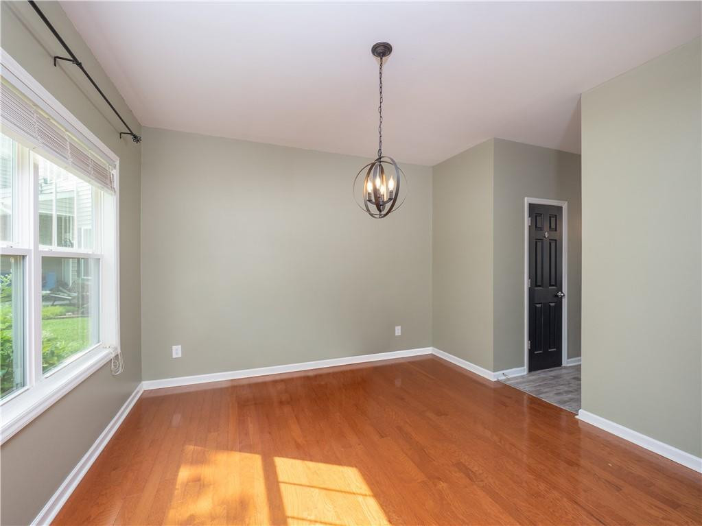 306 Green Pasture Road Mebane, NC 27302 - Photo 6 of 35 a view of empty room with wooden floor and fan