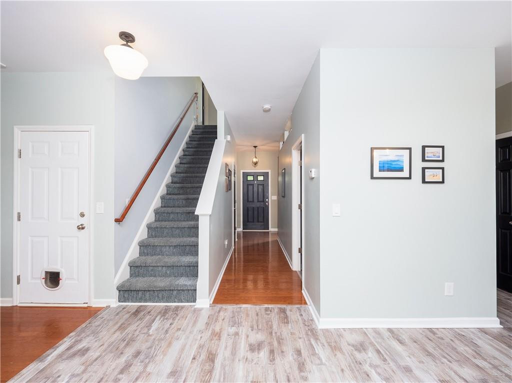 306 Green Pasture Road Mebane, NC 27302 - Photo 8 of 35 a view of a hallway with wooden floor and staircase