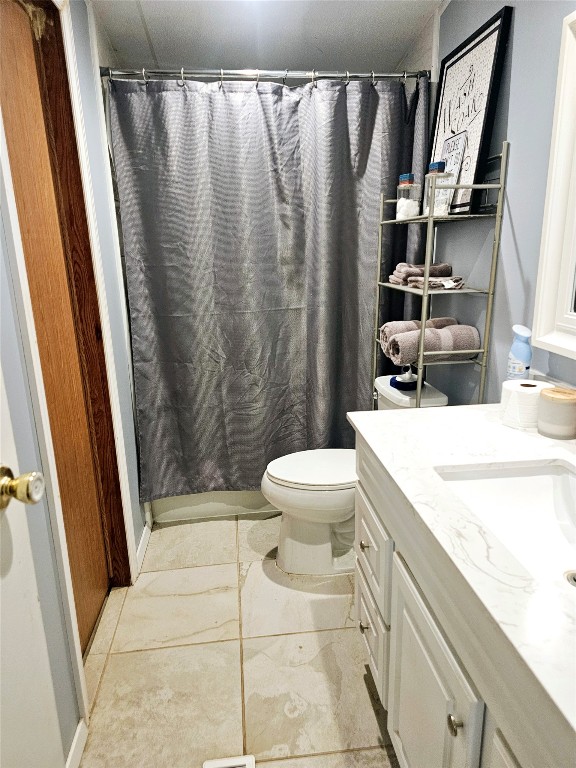 417 Hidden Oaks Drive Elgin, TX 78621 - Photo 17 of 26 a bathroom with a granite countertop sink toilet and shower