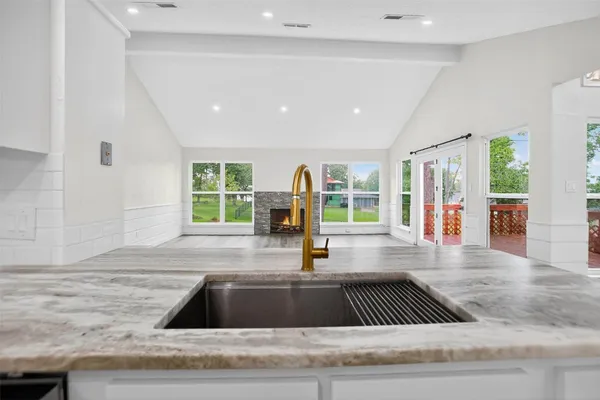 a view of kitchen with wooden floor and window
