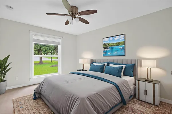 a bedroom with a bed and a window