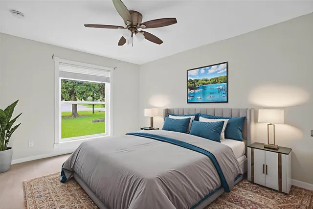 a bedroom with a bed and a window