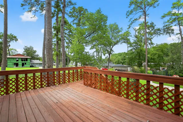 a view of wooden deck with a trees