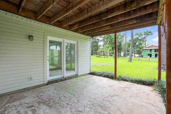 a view of a backyard of the house
