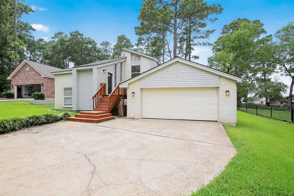 a view of garage yard and tree