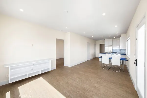 a bathroom with a sink toilet vanity and shower