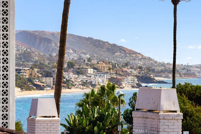 an aerial view of a houses with a yard