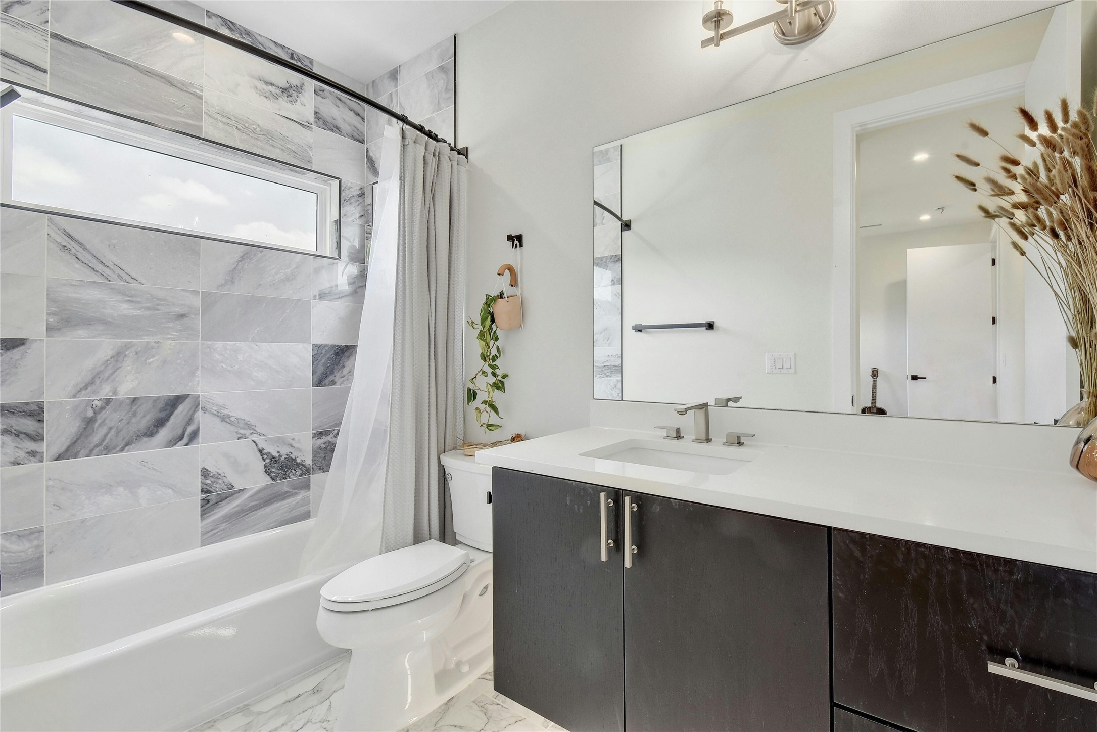 4606 Ledesma Road, Unit 2 Austin, TX 78721 - Photo 23 of 33 Clean lines and a modern vanity define this pristine bathroom space.