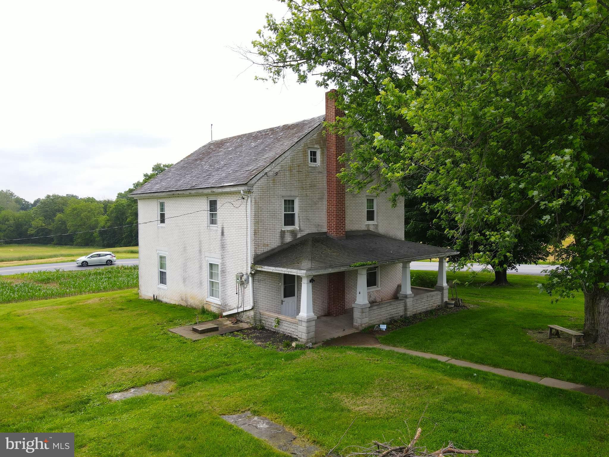 180 Range Road Mount Joy, PA 17552 - Photo 1 of 75 a aerial view of a house with a yard table and chairs