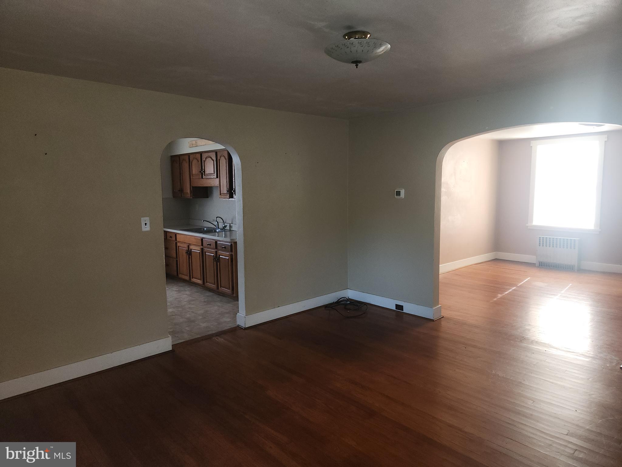 180 Range Road Mount Joy, PA 17552 - Photo 11 of 75 an empty room with wooden floor and windows