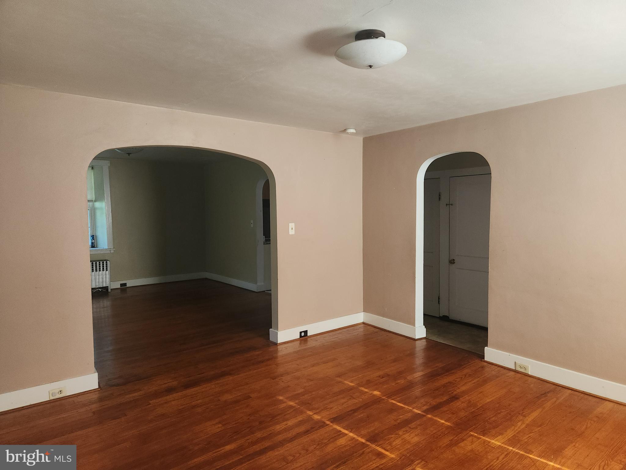 180 Range Road Mount Joy, PA 17552 - Photo 13 of 75 an empty room with wooden floor and windows