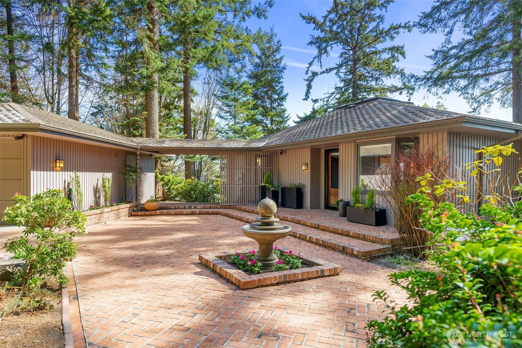 a front view of house with yard outdoor seating and green space