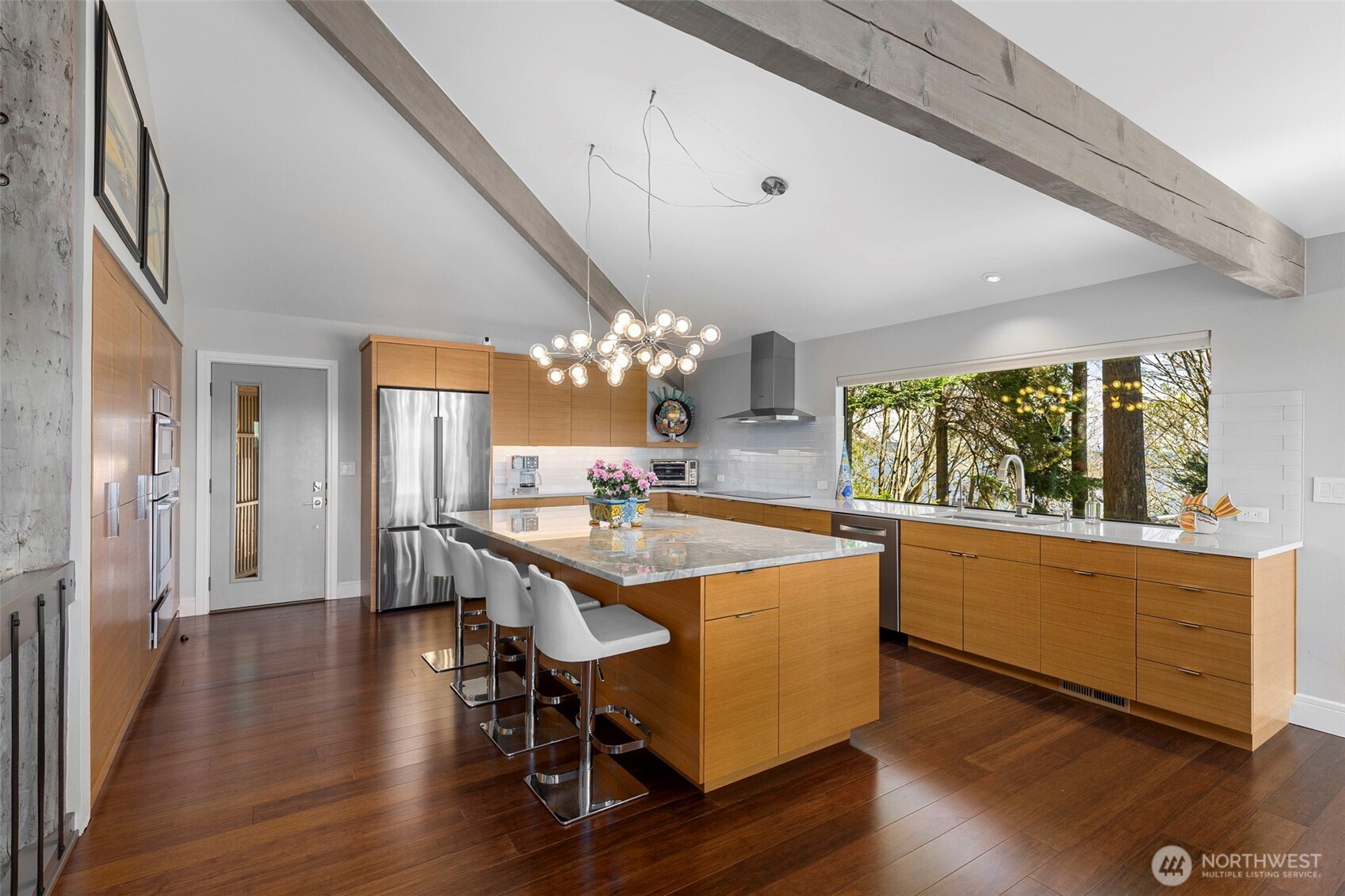 1571 Thorndyke Road Port Ludlow, WA 98365 - Photo 13 of 40 a room with stainless steel appliances granite countertop a stove and wooden floor