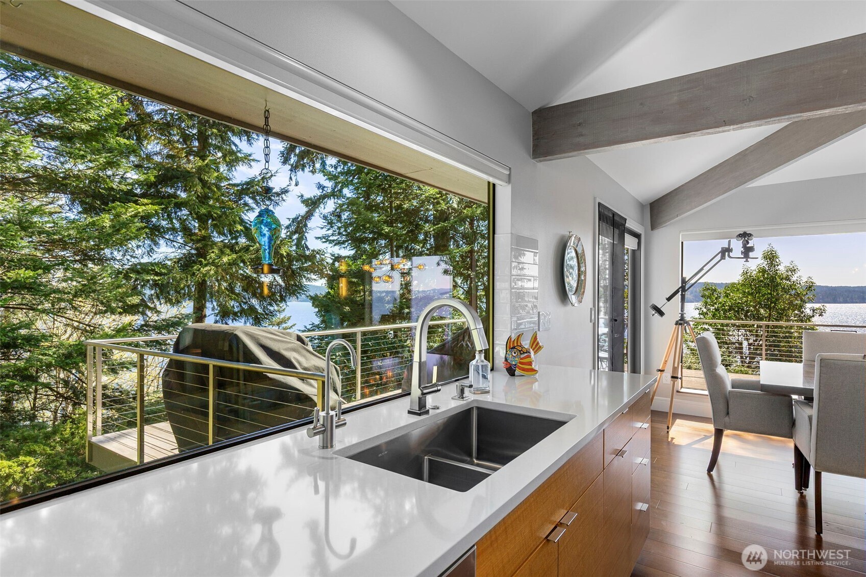 1571 Thorndyke Road Port Ludlow, WA 98365 - Photo 14 of 40 a view of kitchen and dining room with wooden floor