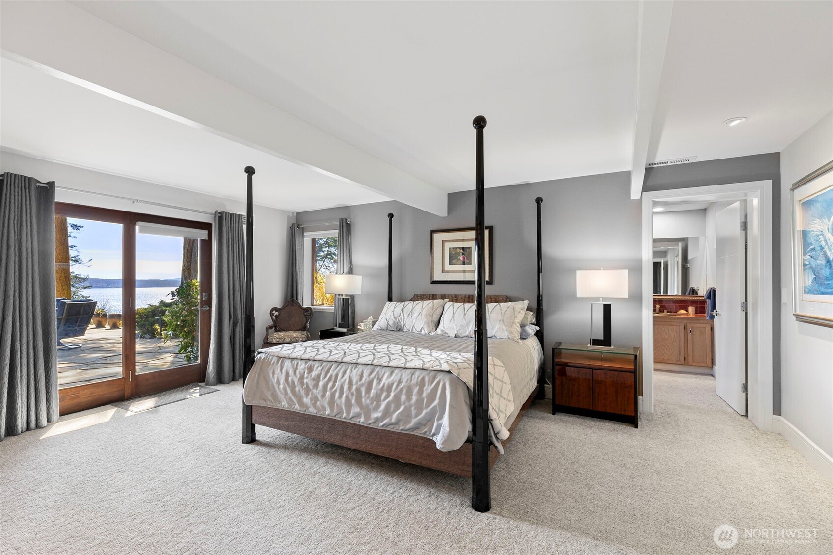 1571 Thorndyke Road Port Ludlow, WA 98365 - Photo 19 of 40 a bedroom with a bed and large window