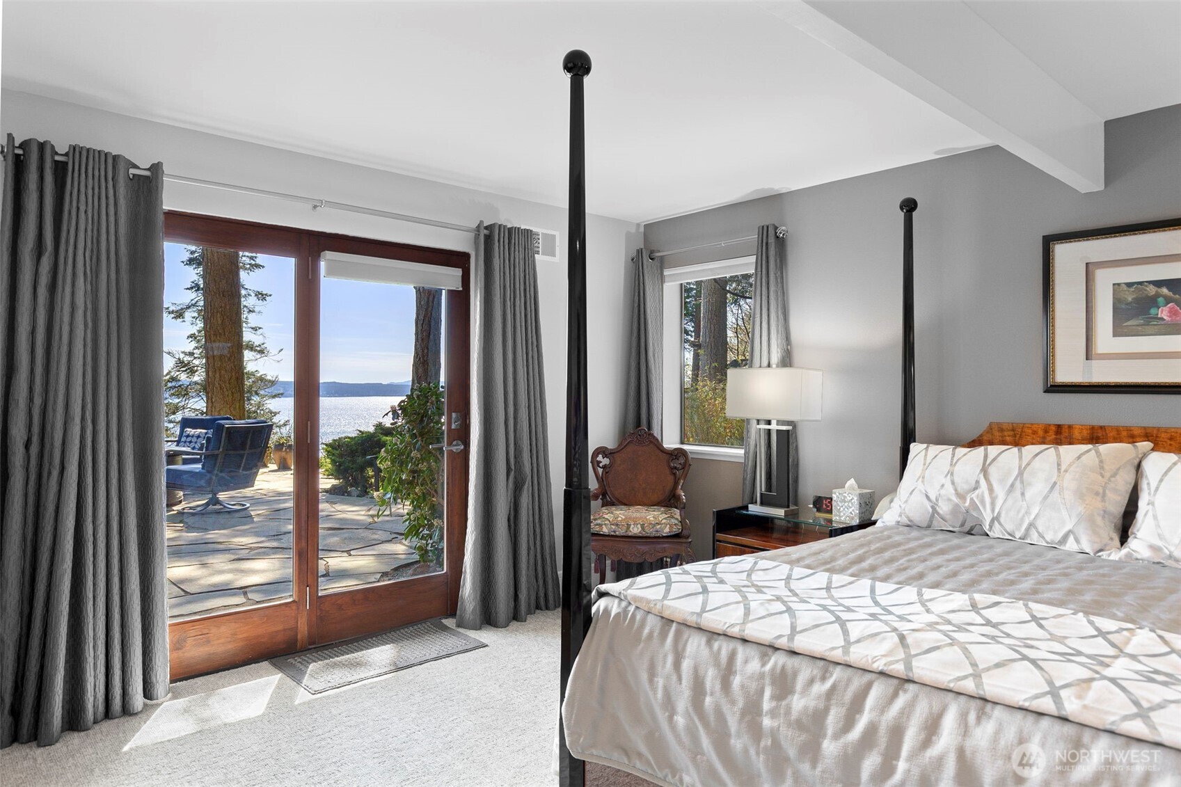 1571 Thorndyke Road Port Ludlow, WA 98365 - Photo 20 of 40 a bedroom with a bed and a dresser next to a window