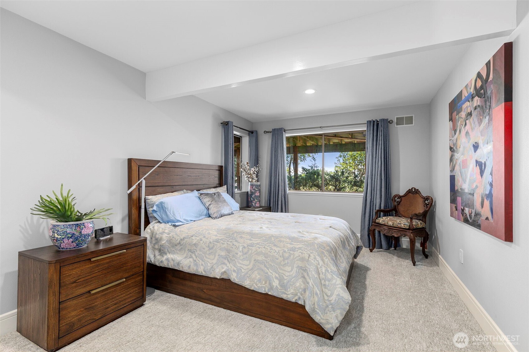 1571 Thorndyke Road Port Ludlow, WA 98365 - Photo 24 of 40 a bedroom with a large bed and a window