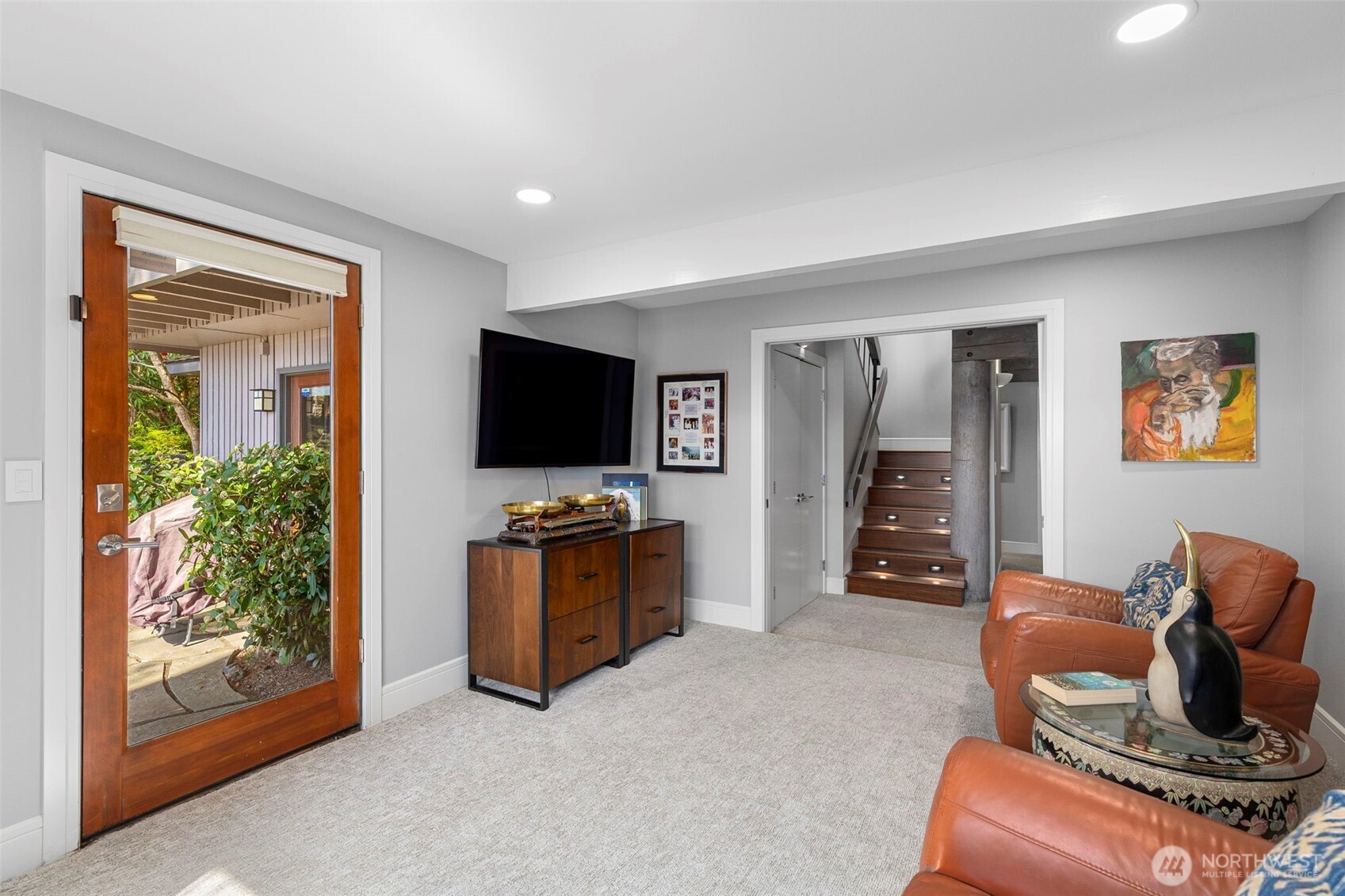 1571 Thorndyke Road Port Ludlow, WA 98365 - Photo 27 of 40 a living room with furniture and a flat screen tv