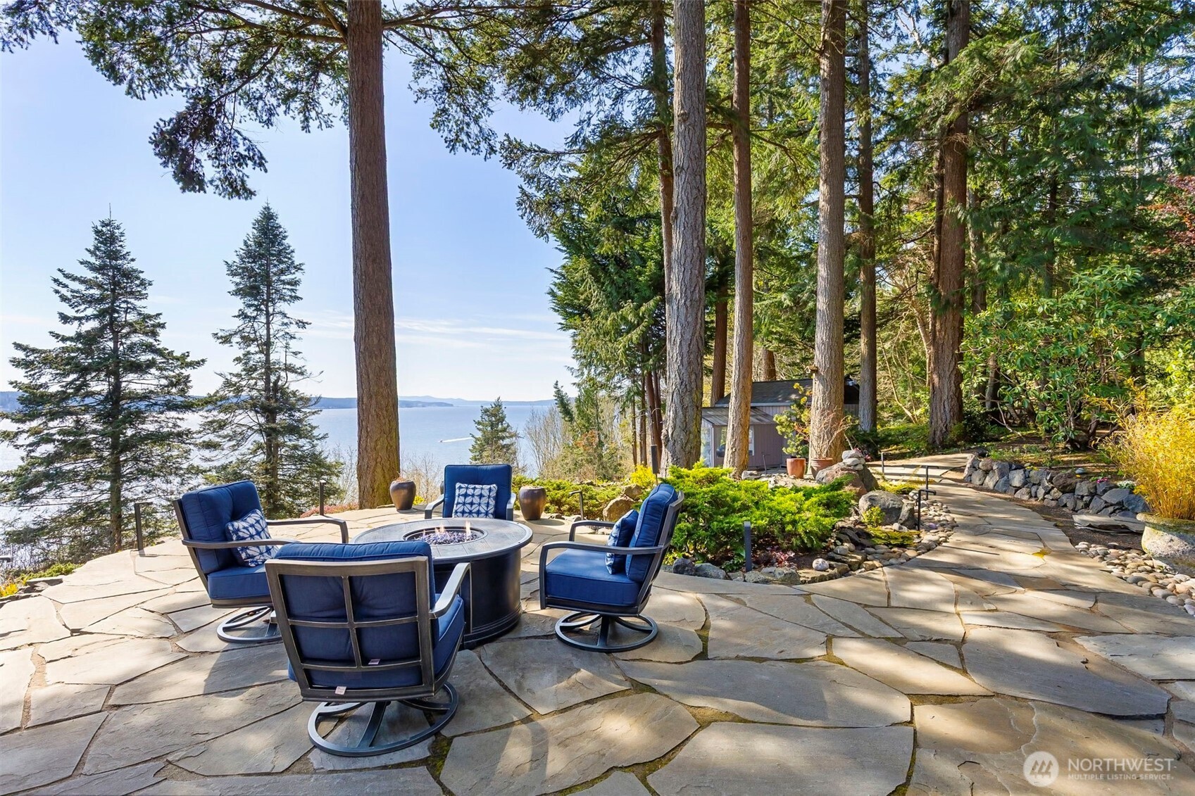 1571 Thorndyke Road Port Ludlow, WA 98365 - Photo 31 of 40 a view of swimming pool with lawn chairs and couches with wooden fence