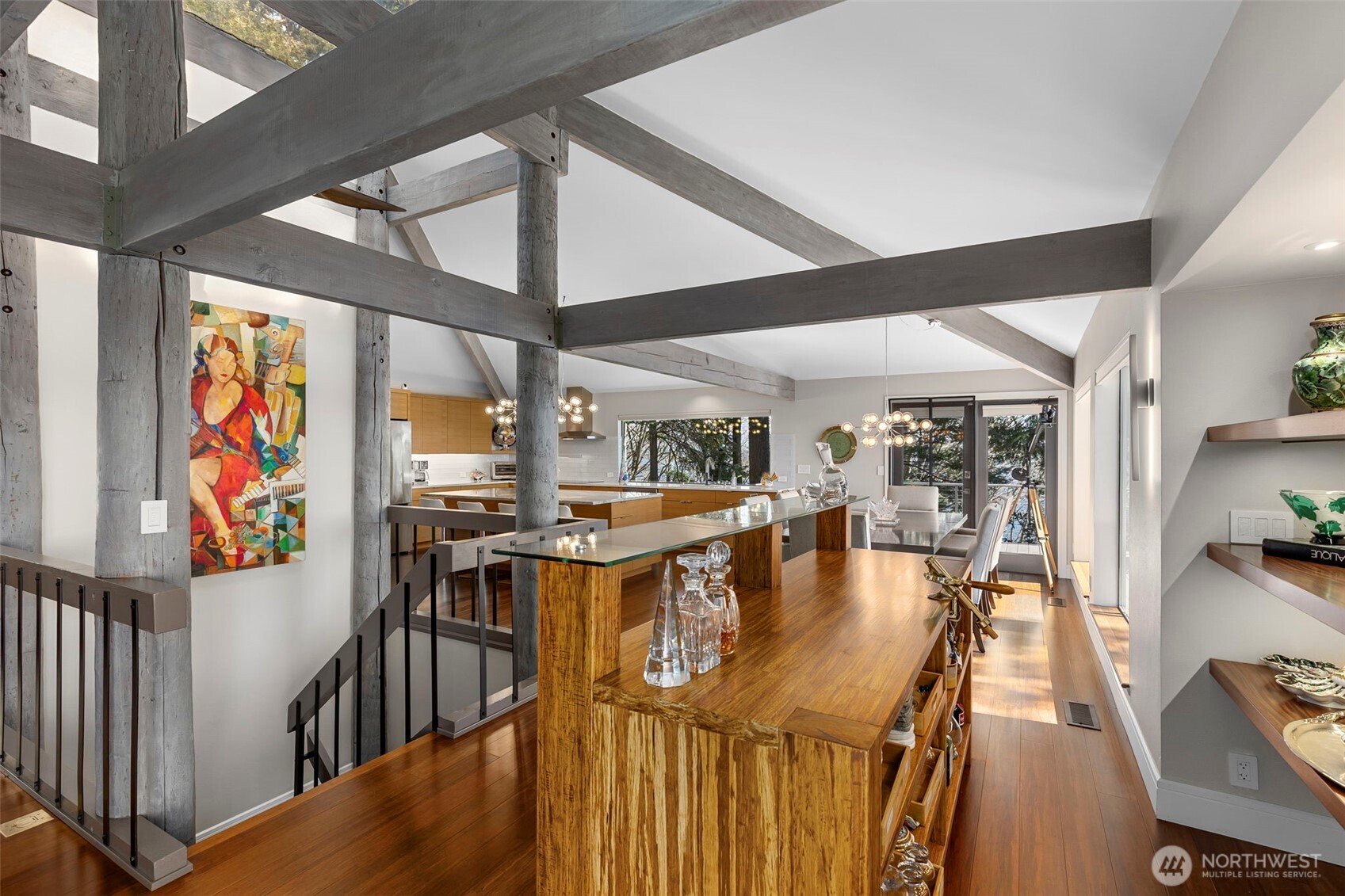 1571 Thorndyke Road Port Ludlow, WA 98365 - Photo 6 of 40 a dining room with furniture one side kitchen view and wooden floor