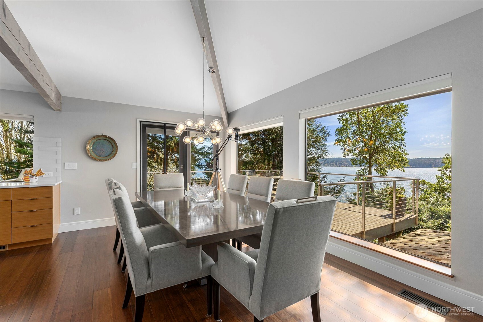 1571 Thorndyke Road Port Ludlow, WA 98365 - Photo 8 of 40 a dining room with furniture a chandelier and wooden floor