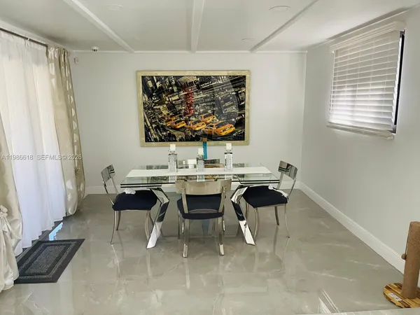 a view of a workspace with furniture