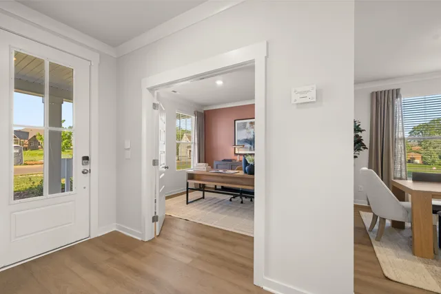 a dining room with a table and chairs