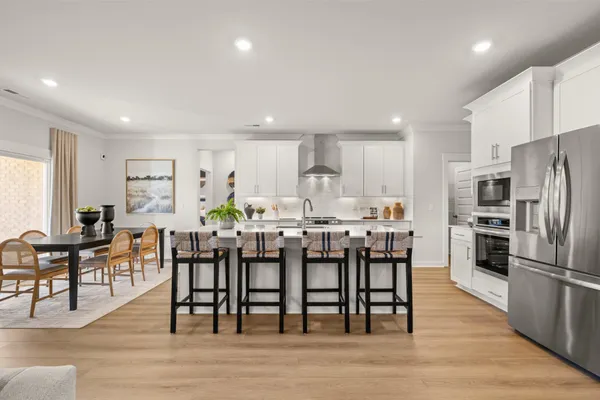 a kitchen with stainless steel appliances a refrigerator stove and sink