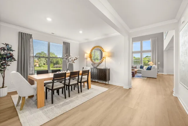 a kitchen with stainless steel appliances a stove a sink a refrigerator and cabinets